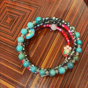 Blue and Red Beaded Bracelet with Circular Shape and Unique Textures